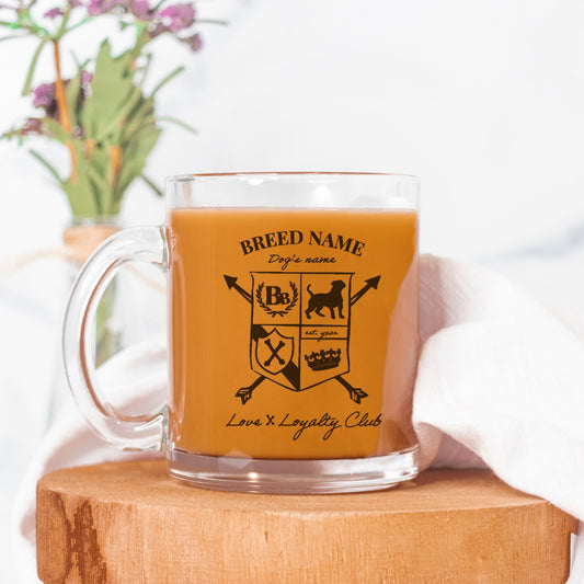 Clear mug with a design on a wooden block with a white background